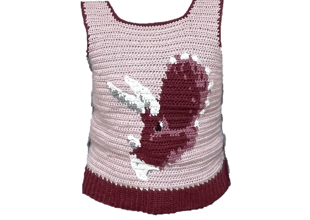Crocheted pink vest with a maroon dinosaur on the front